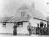 232-bui : Mr. and Mrs Barnett outside Pear Tree Cottage, Barton Road (c. 1900)